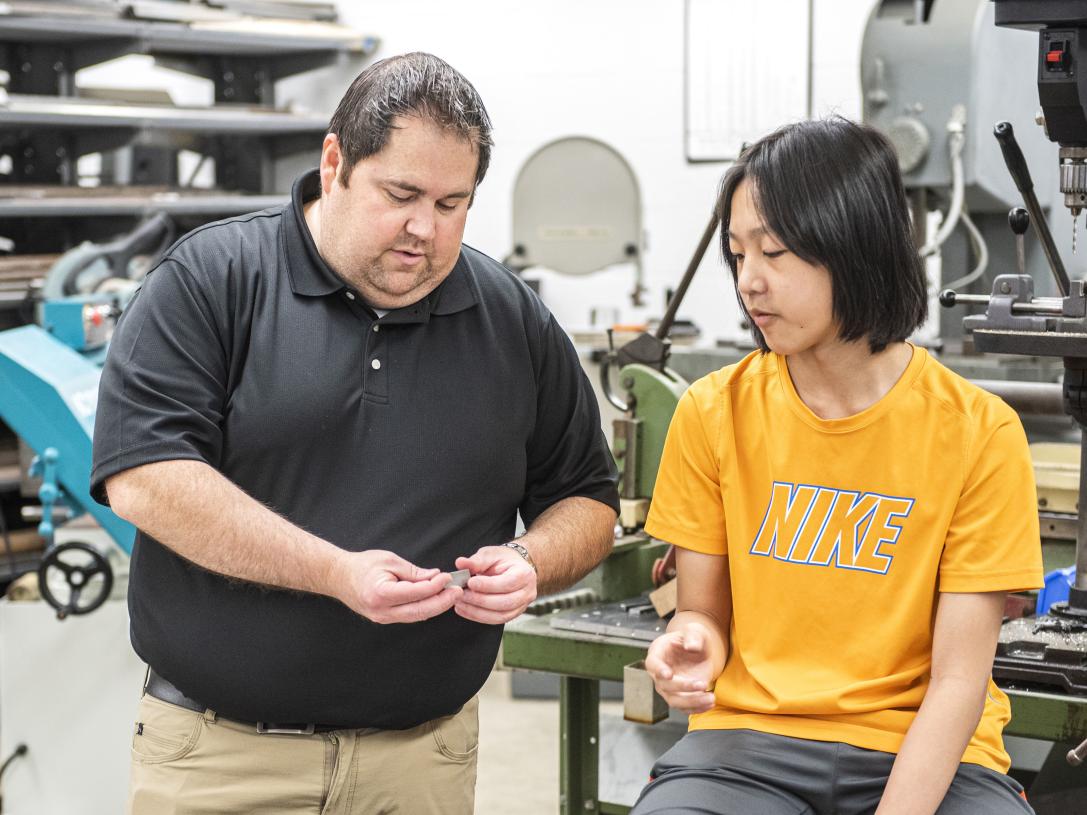 Nicholas Gray checks a student's work