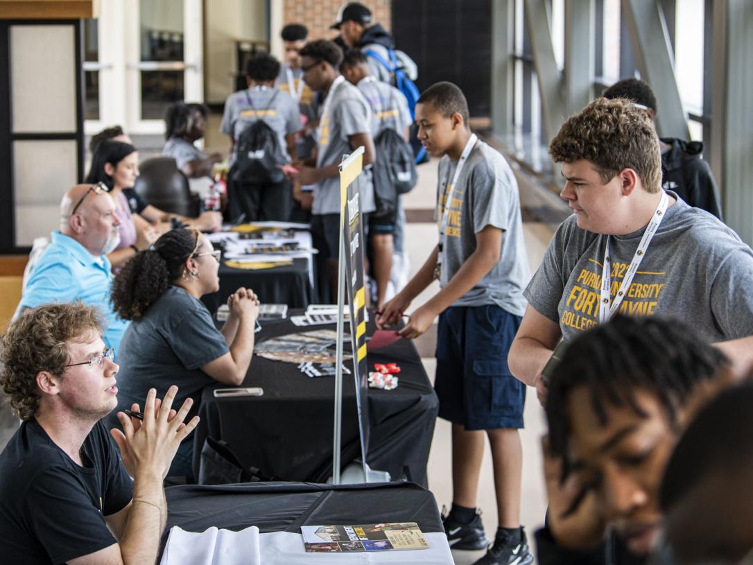 Students signing in at the College Experience