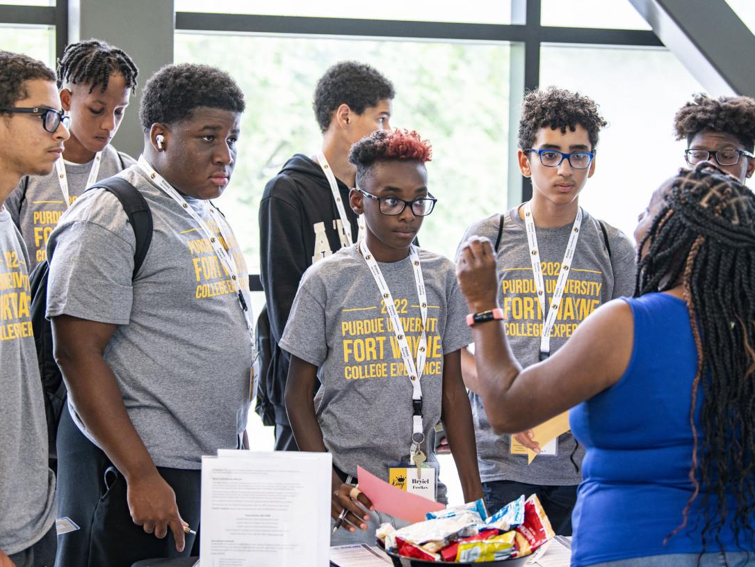 Students signing in at the College Experience