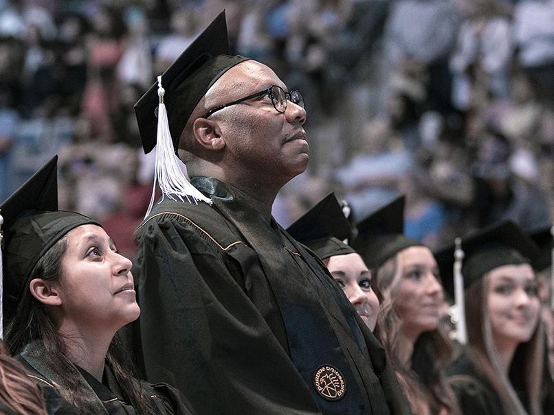 De'Onte Brewer looking up at the crowd at commencement