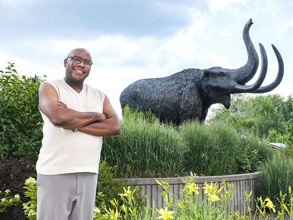 De'Onte Brewer is standing close to the mastodon statue