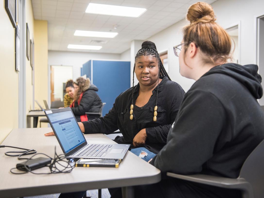 Employee advising student