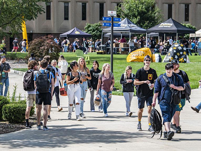 Students are walking near the science mall