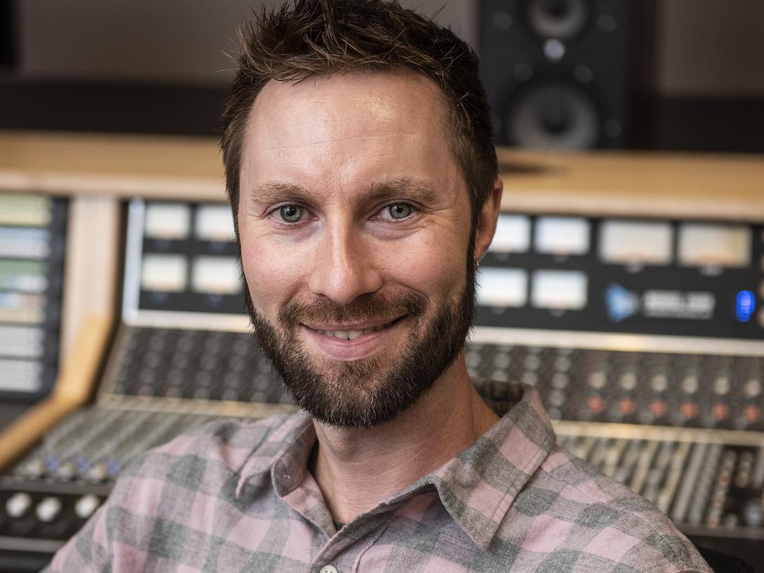 Portrait of John Buteyn in a recording studio