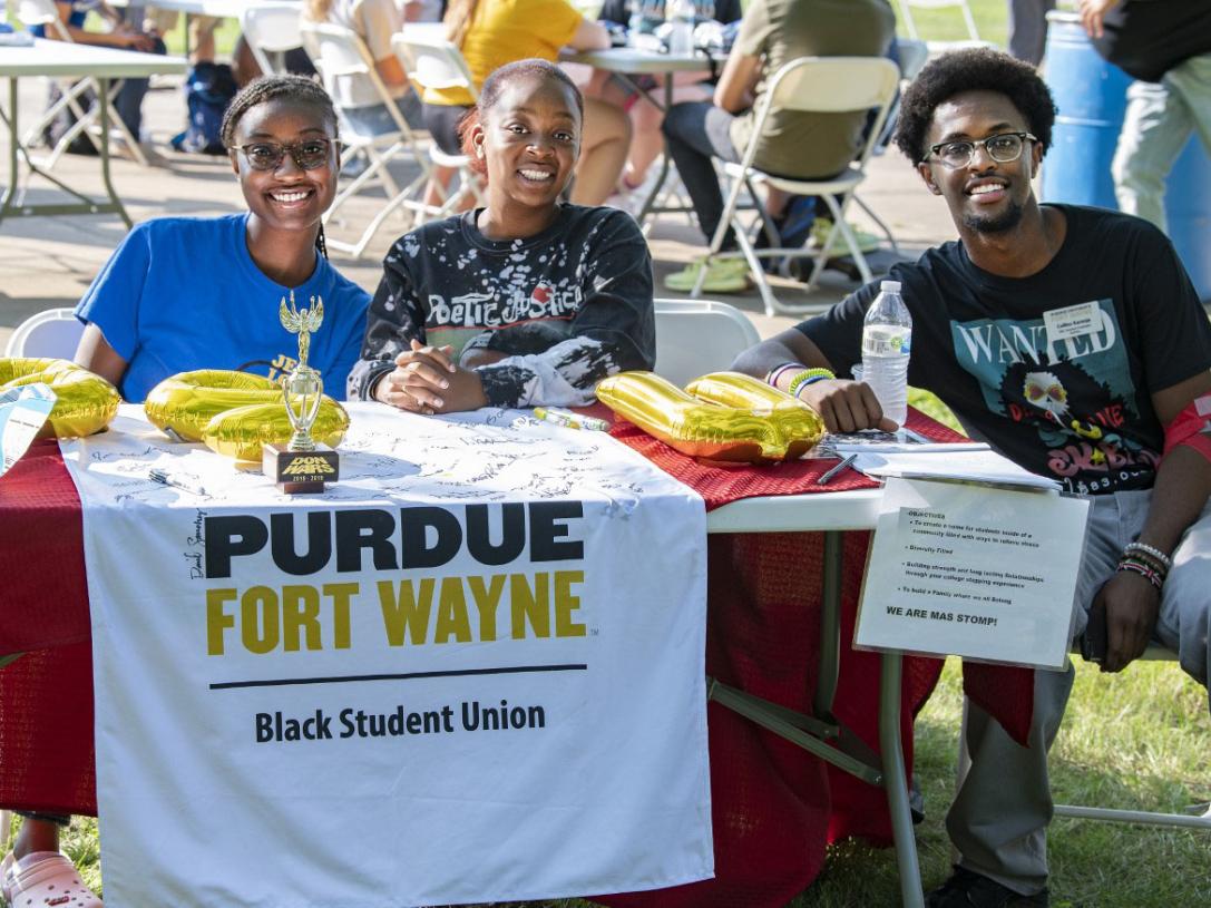 T. Hardy (center) and fellow Black Student Union members Alicia Kingsberry and Collins Karanja at a student event.