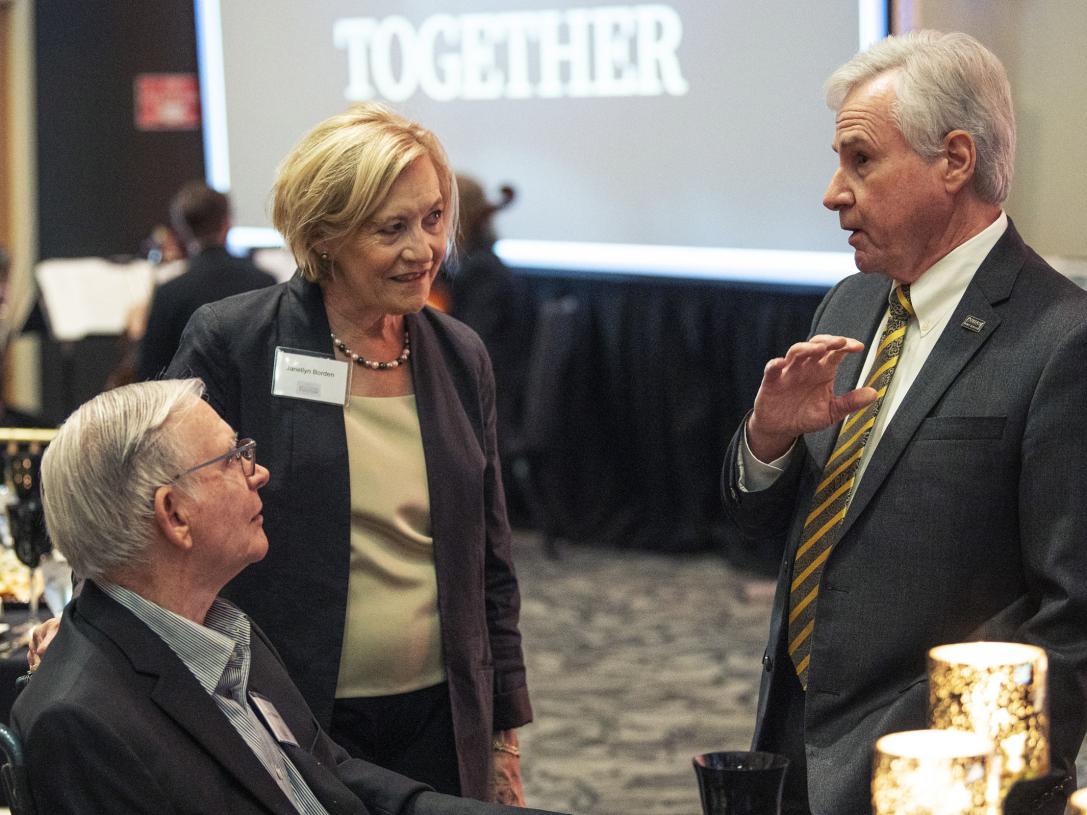 Chancellor Ron Elsenbaumer chats with Glenn and Janellyn Borden at the Celebrate Philanthropy Dinner.