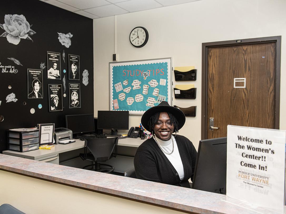 Cicelle Beemon is behind a desk in her office