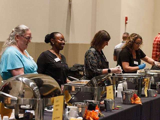 Servers at the chancellor's chili fest