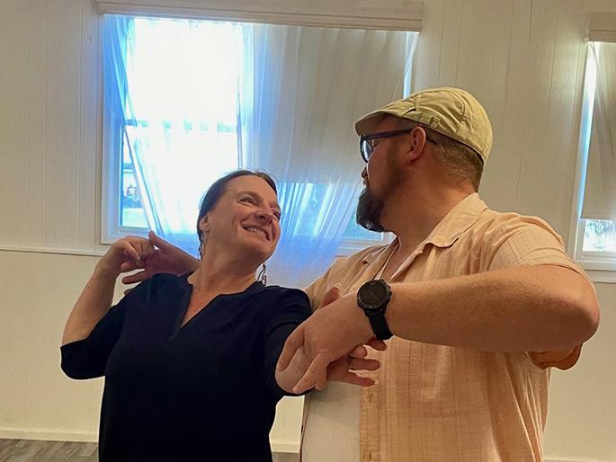 Chris Kuznar is dancing with her instructor