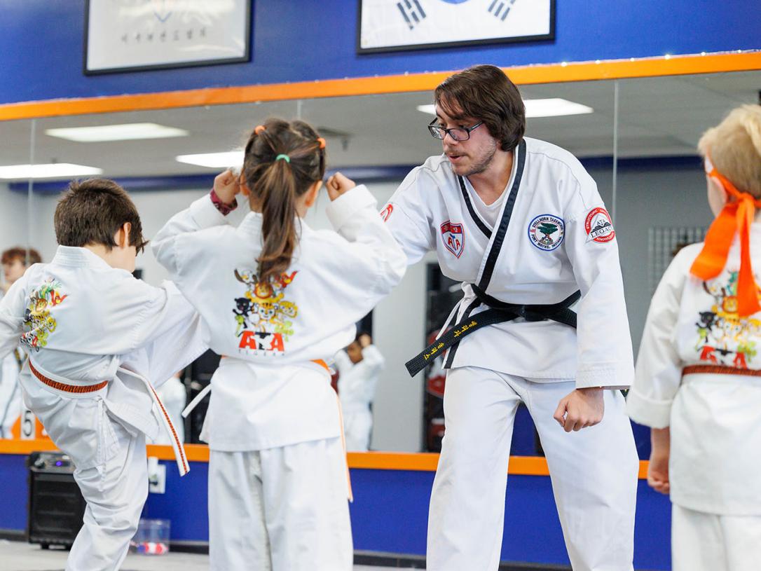 Elijah Solis teaching in a Taekwondo class