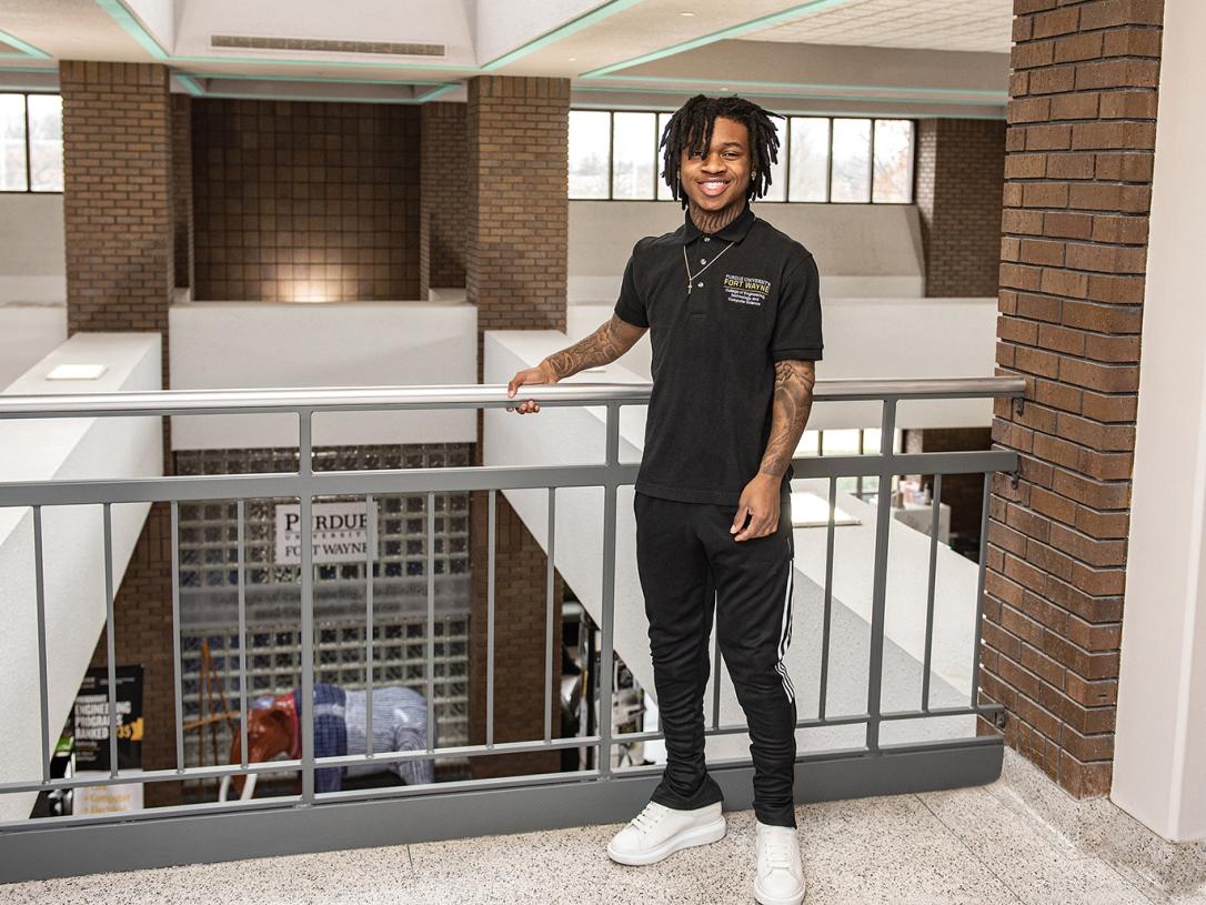 Triston Stevens poses in the lobby of the engineering building at Purdue Fort Wayne.