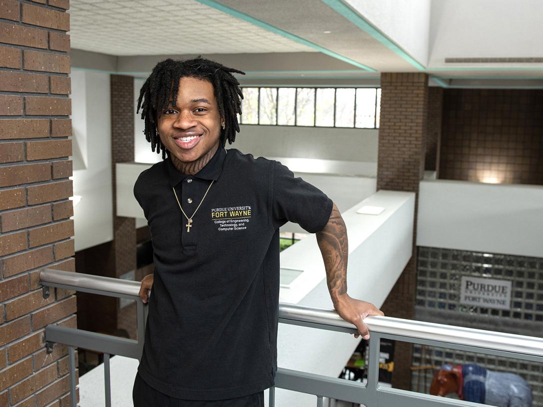 Triston Stevens poses in the lobby of the engineering building at Purdue Fort Wayne.