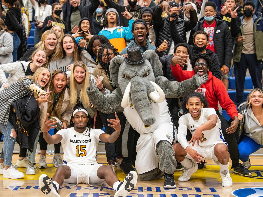 Basketball players with crowd