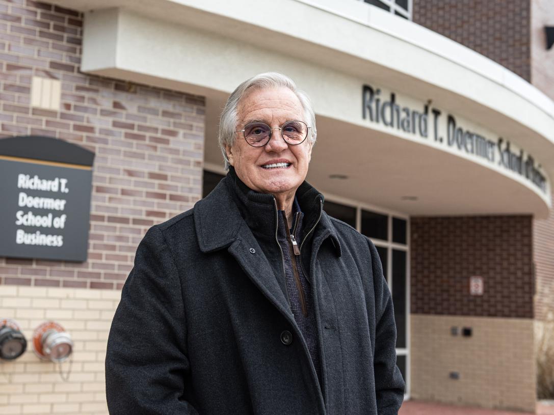 Portrait of Jim McHann outside the Doermer School of Business Building