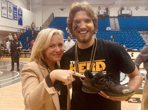 Director of Athletics Kelley Hartley Hutton and Josiah Beck, "The Shoe Guy."