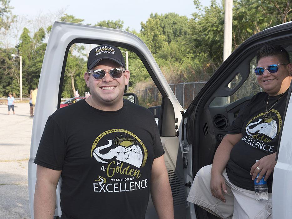 James Velez is representing Purdue Fort Wayne at a parade