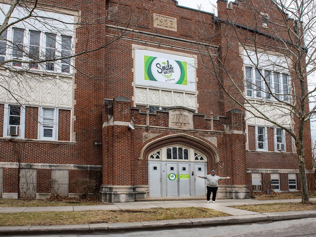 Terel Linn is standing outside of the building that houses his business