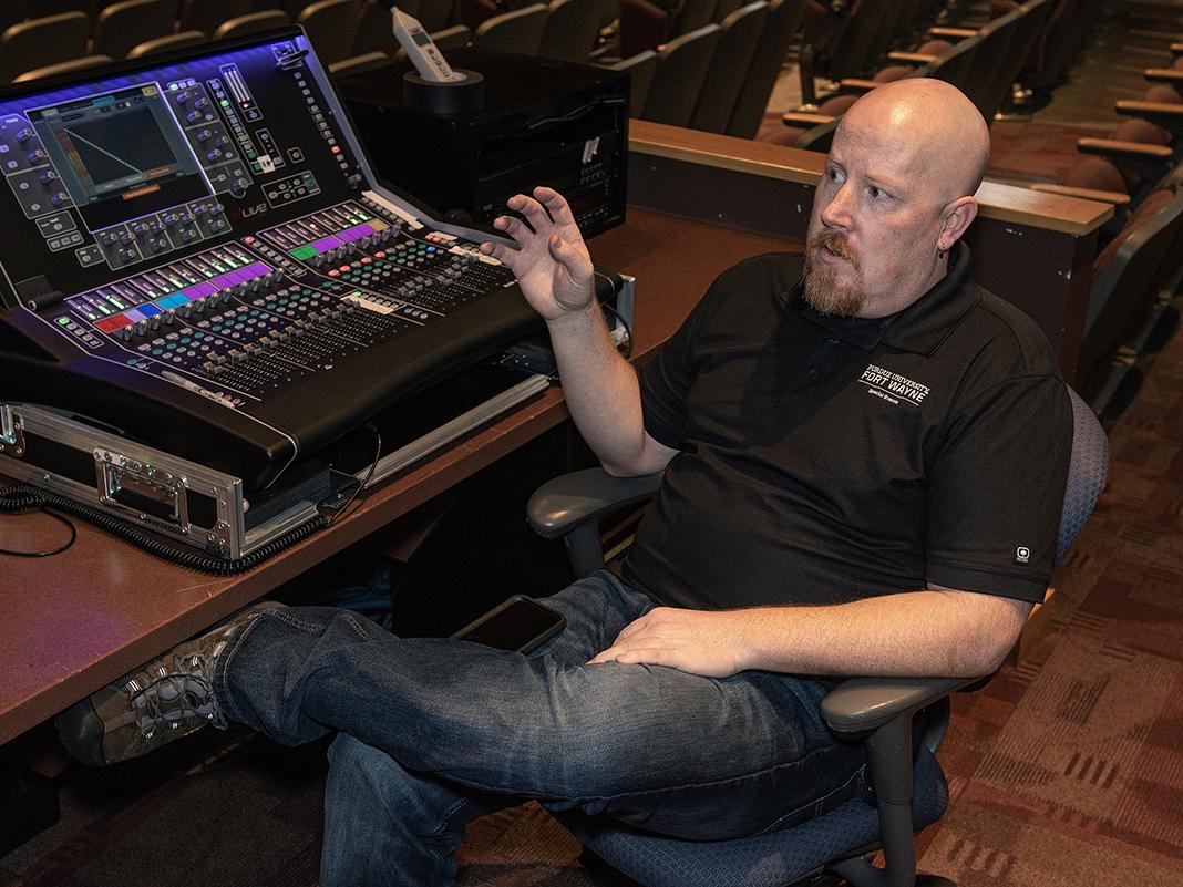 Tom Wilson is relaxing beside a sound board
