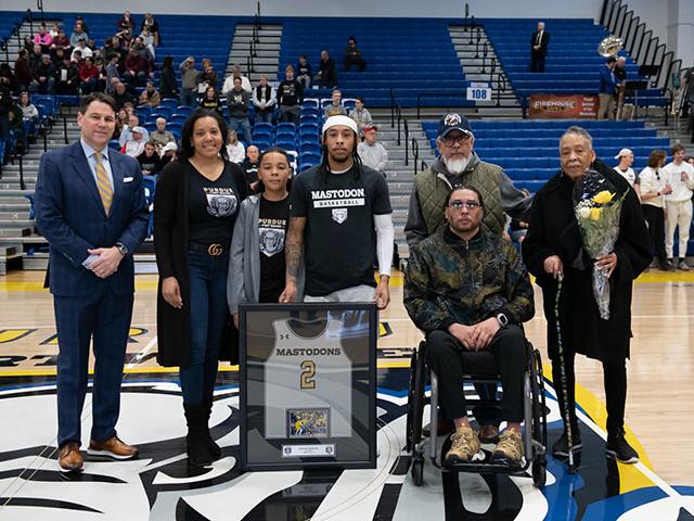 Damian Chong-Qui at senior night with his family and friends in center court
