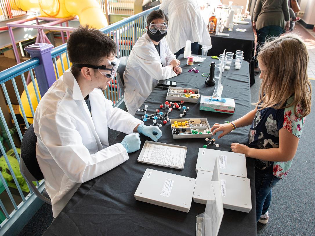 Students at a chemistry booth