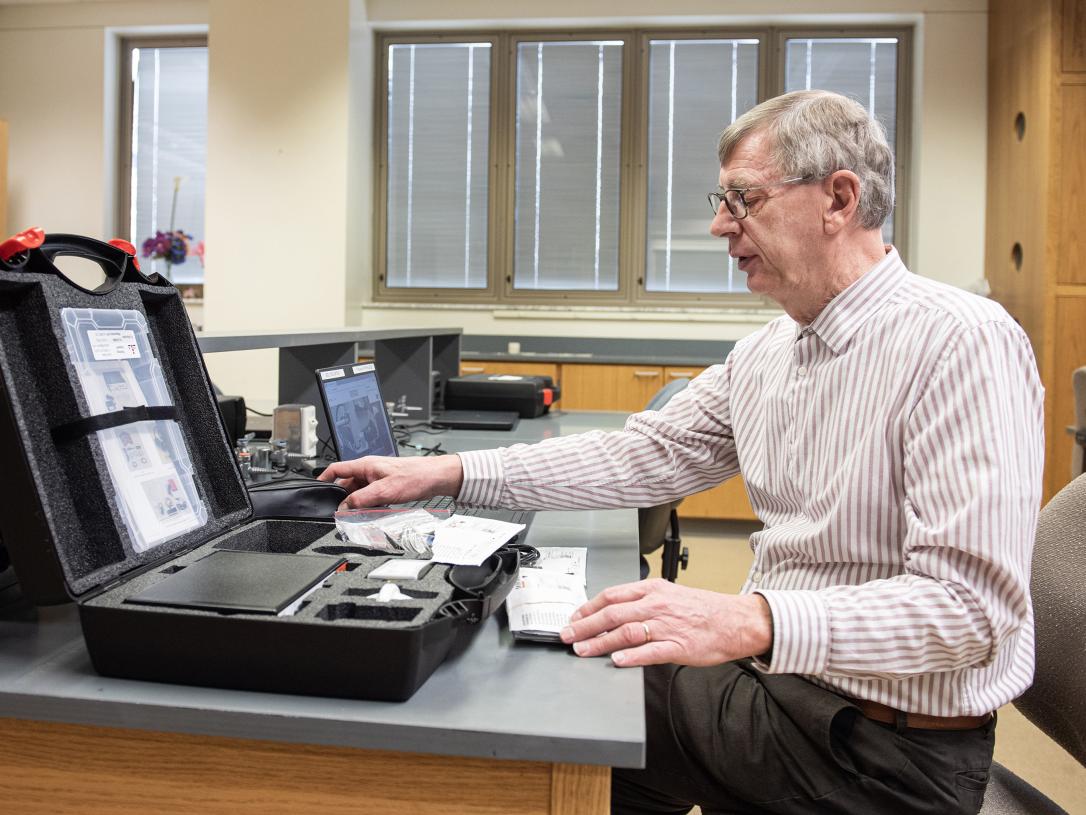 Bruce Arnold is working in his office