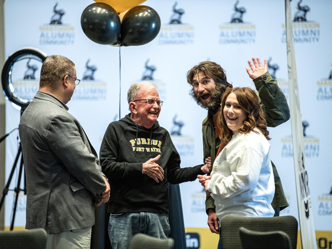 Alumni shaking hands