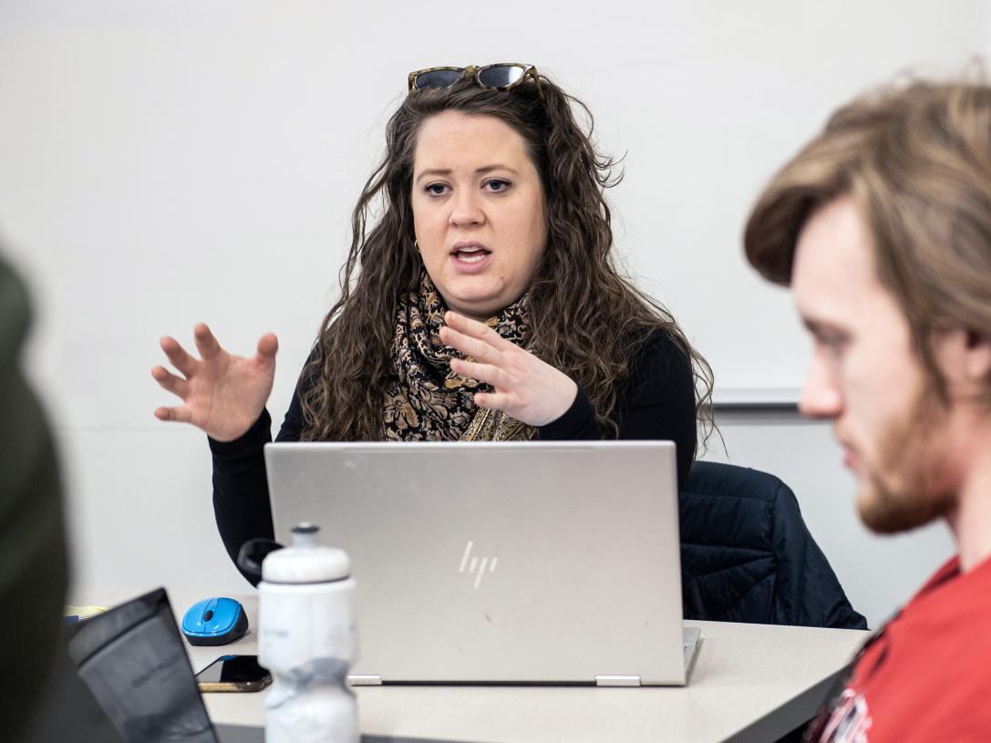 Erin McCarthy meets with students in an English 131 class.