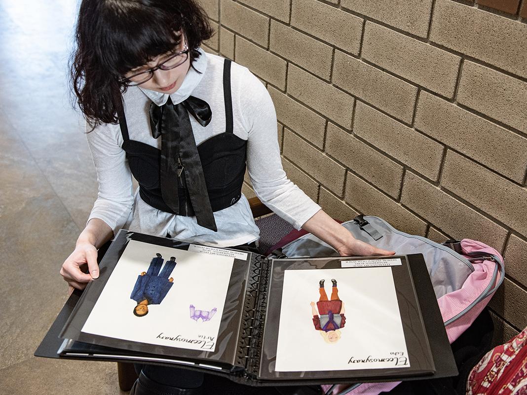 Stephanie Spotts displays her portfolio