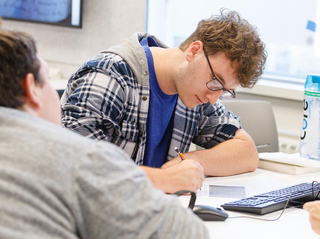 Students working on notes in Jeff Malanson's history class.