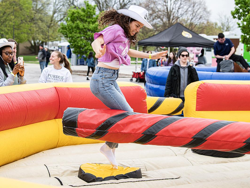 A student is enjoying bounce house at Mastodons Big Night