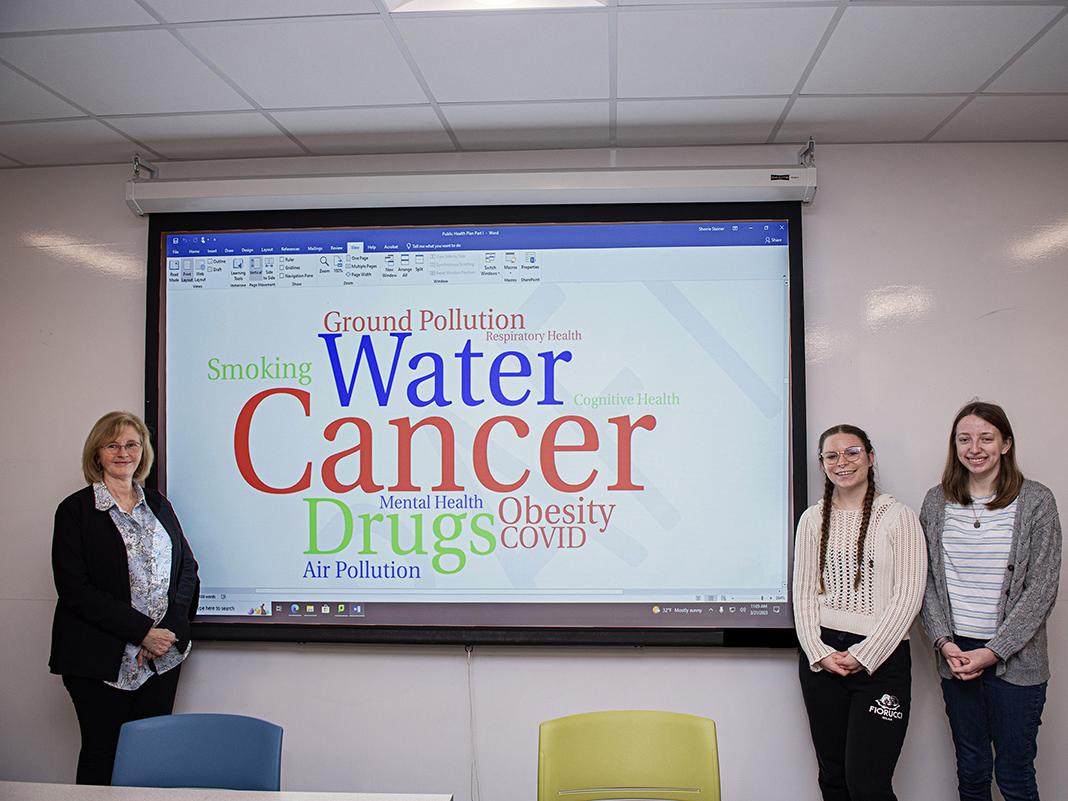 Professor Sherrie Steiner and two of her students