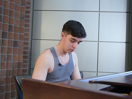 David Janeczko is playing the piano