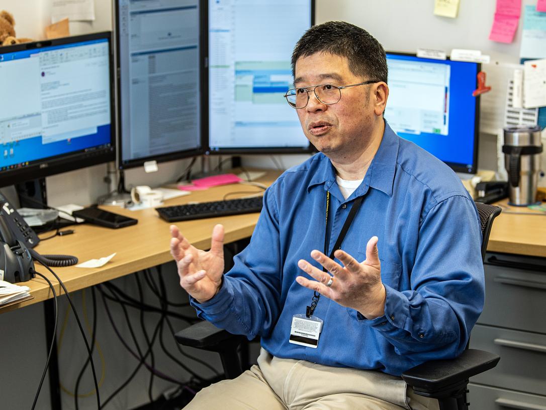 Daniel Lin is talking in his office