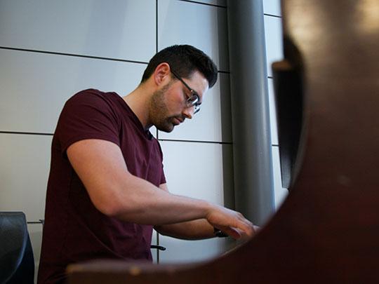 Preston Graber is playing the piano.