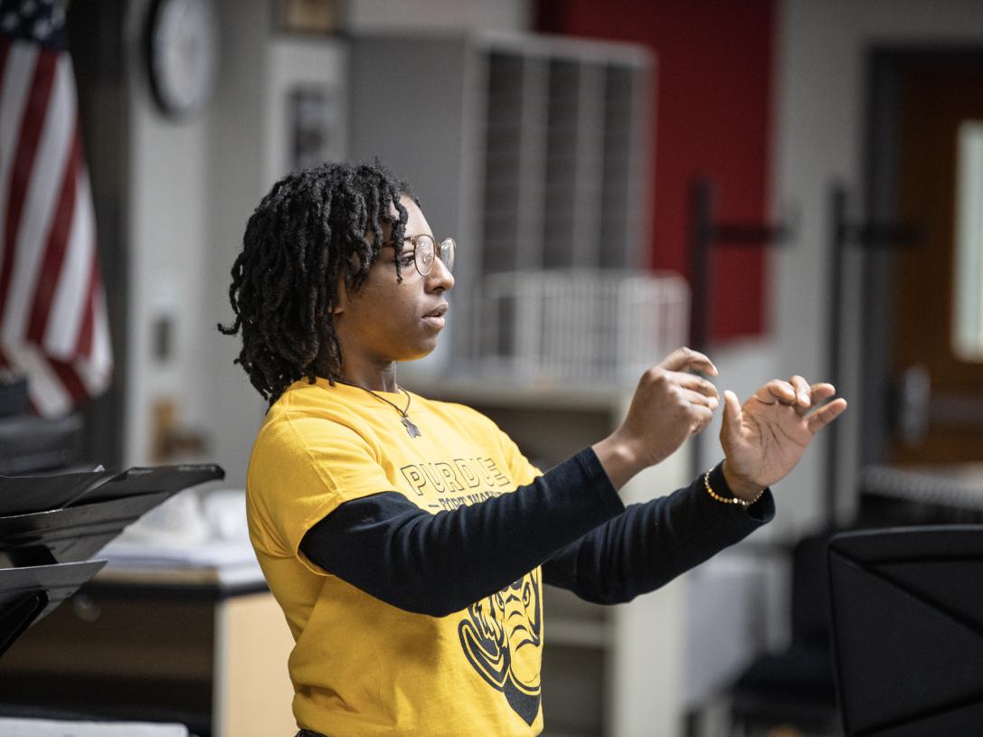 Senior music education major Kayla Weddington conducts the Fusion Band at a recent rehearsal.