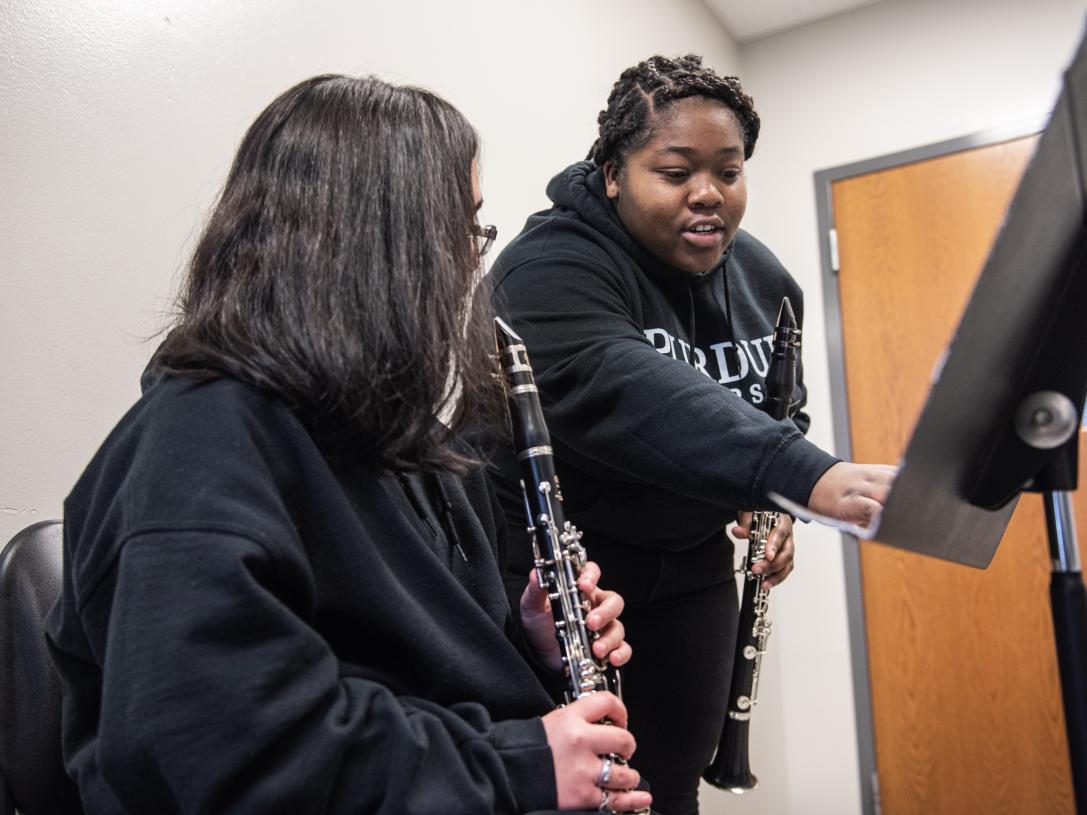 Music education major Jamia Green instructs a student during a clarinet lesson.