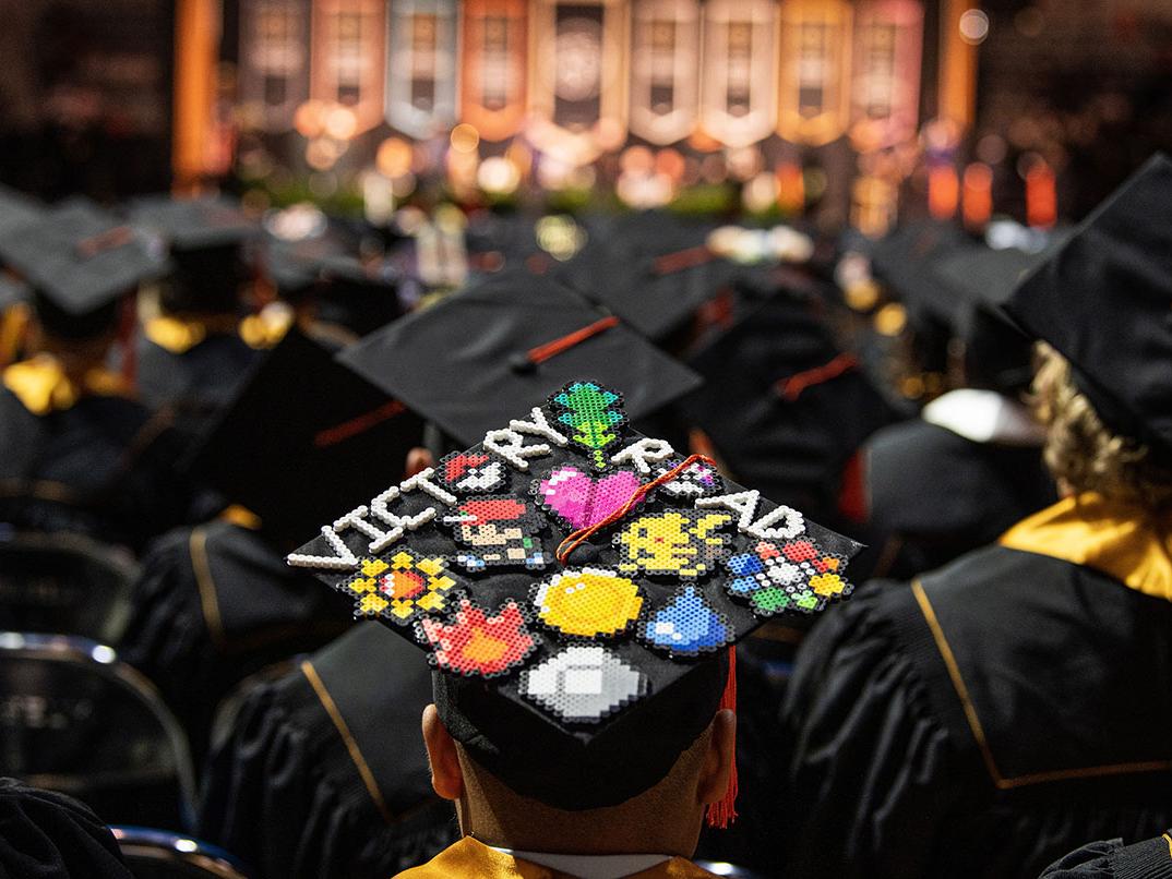 A graduate with a decorated cap.