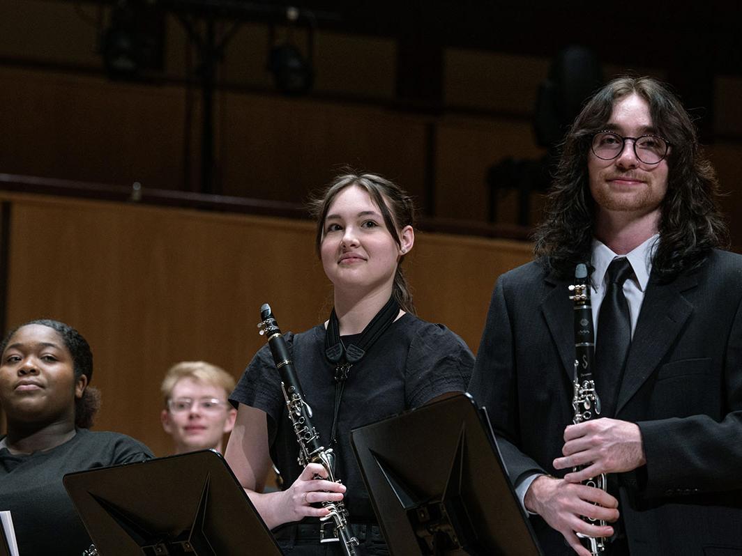 Clarinets take a bow at a Symphonic Wind Ensemble concert.
