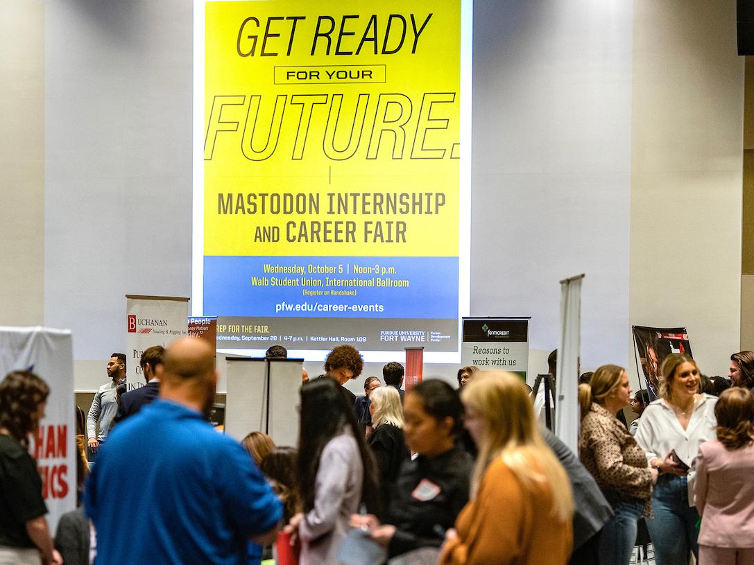 Students and employers exploring the career fair on campus.