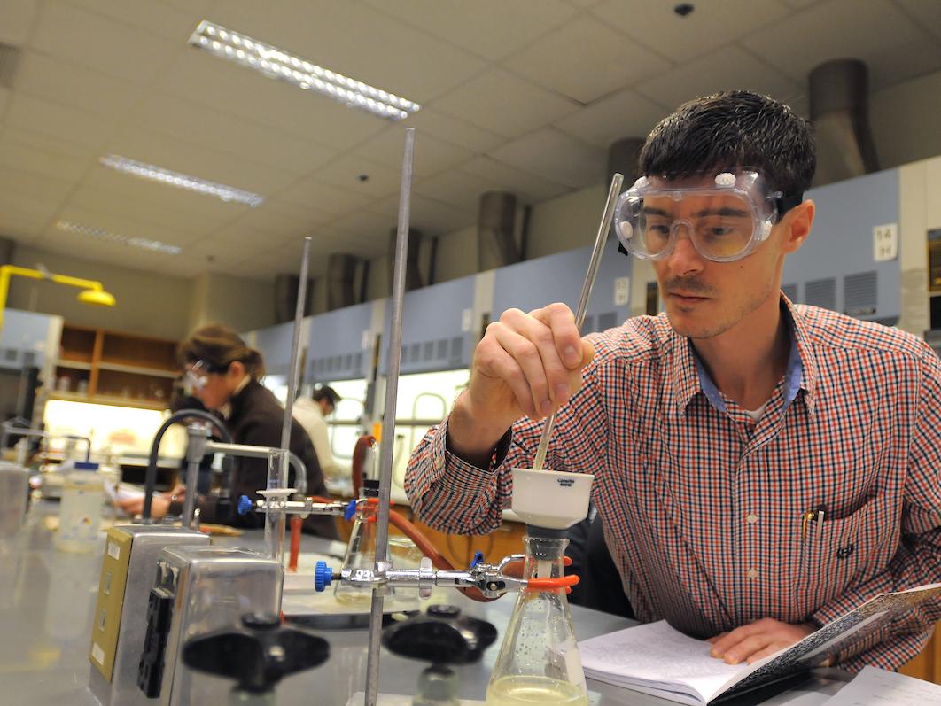 Student conducting an experiment in a lab