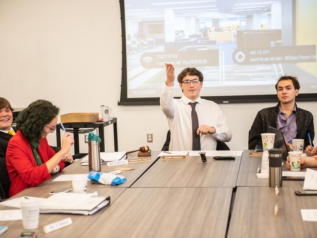 Students sitting around a table