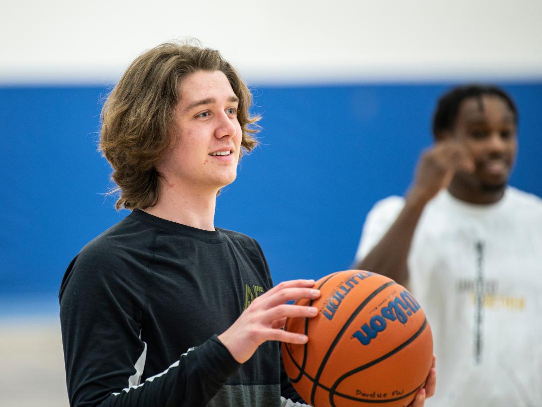 Student holding a basketball