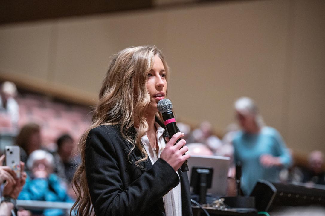 An honors student asks a question during an Omnibus Speaker Series event.