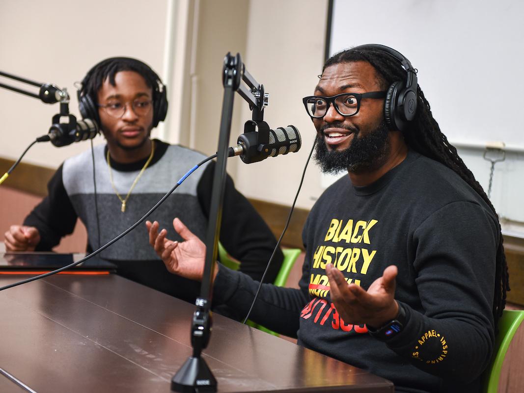 Students recording a podcast