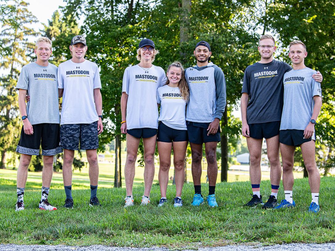 Seven cross country teams members who are twins