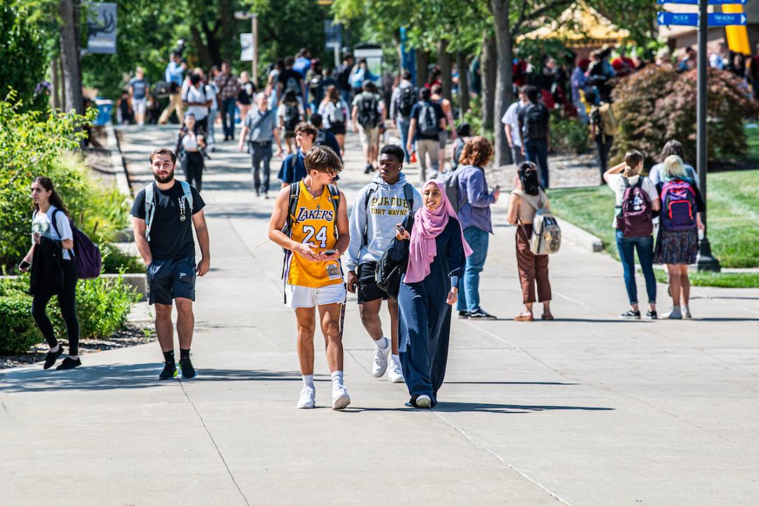 Students walking outside on campus.