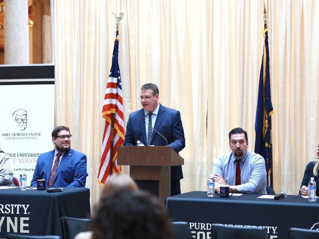 Michael Wolf is leading a panel discussion at the Indiana Statehouse