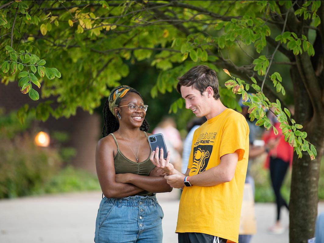 Students talking outside during Campus Kickoff.