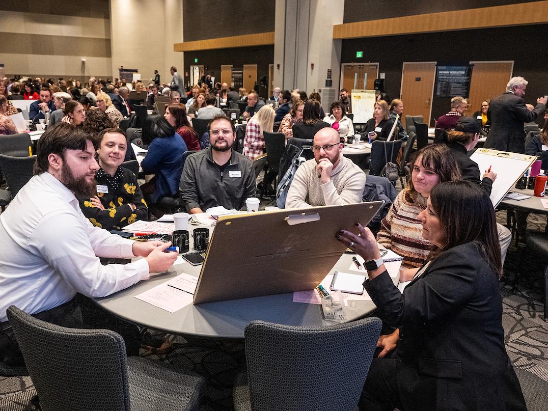 Group of people sitting around a table