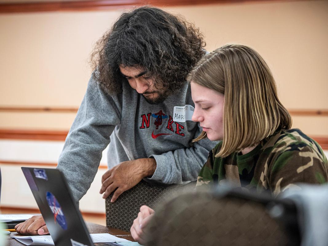 Students working on a computer together.
